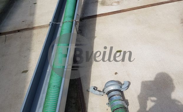 Drijver met aanzuigslang